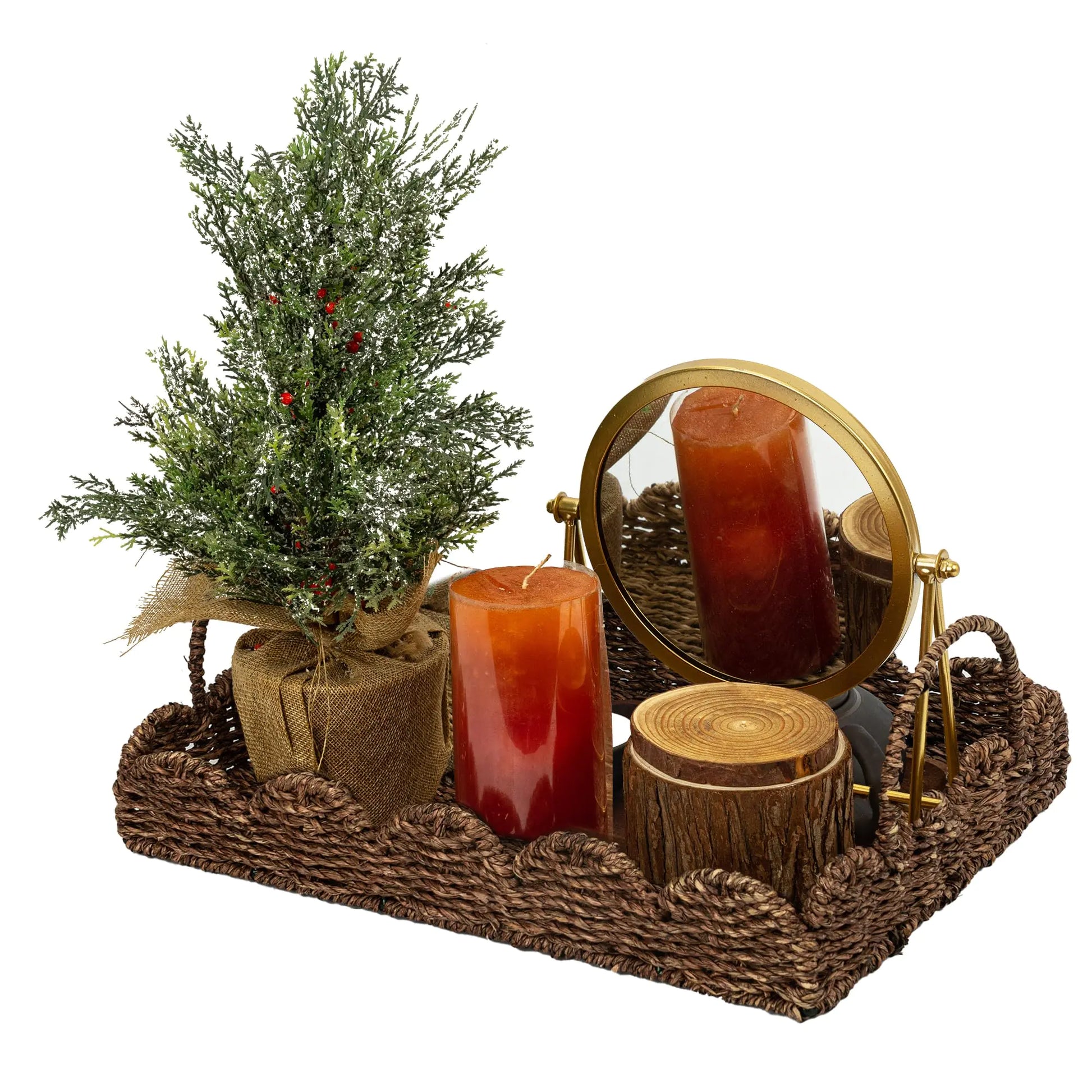 Seagrass tray showcasing a decorative arrangement with candles, a mirror, and a miniature tree for elegant home decor.